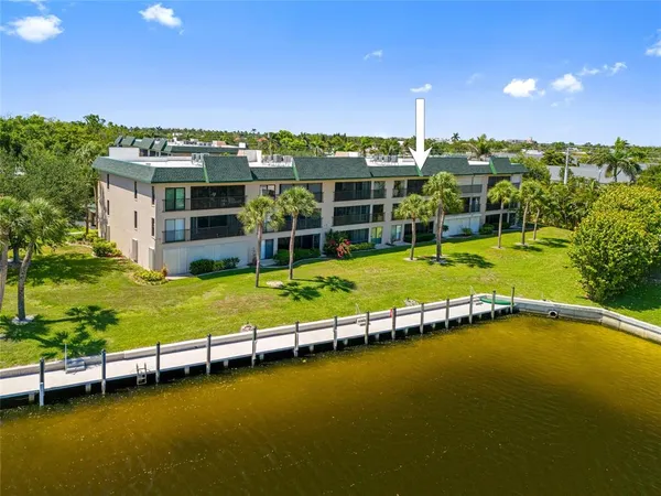 a view of a swimming pool with lawn chairs