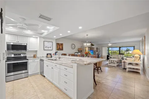 a kitchen with a sink and a stove top oven