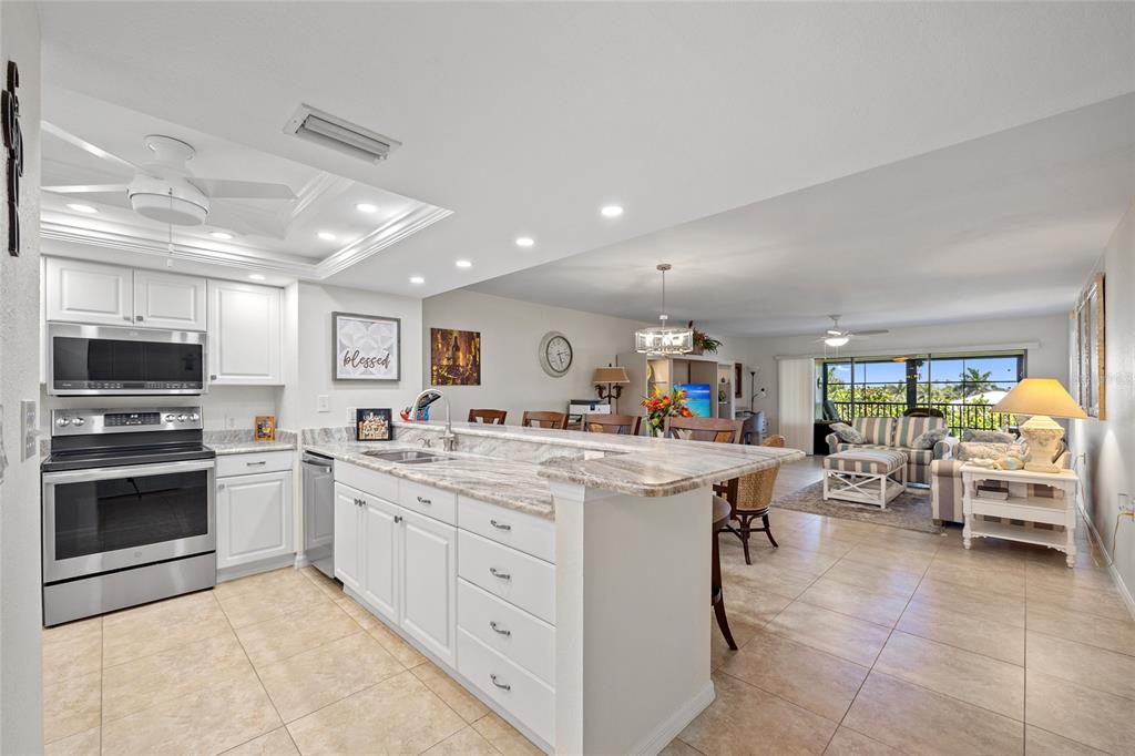 601 Shreve Street, Unit 53C Punta Gorda, FL 33950 - Photo 3 of 30 a kitchen with a sink and a stove top oven