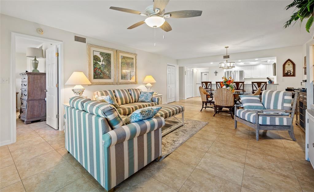 601 Shreve Street, Unit 53C Punta Gorda, FL 33950 - Photo 6 of 30 a living room with furniture and a chandelier