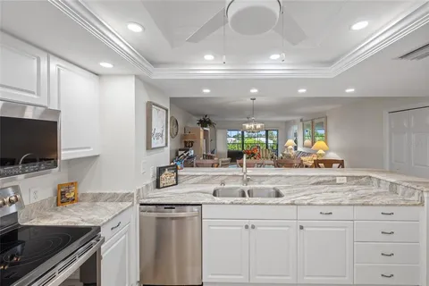 a kitchen with center island and stainless steel appliances