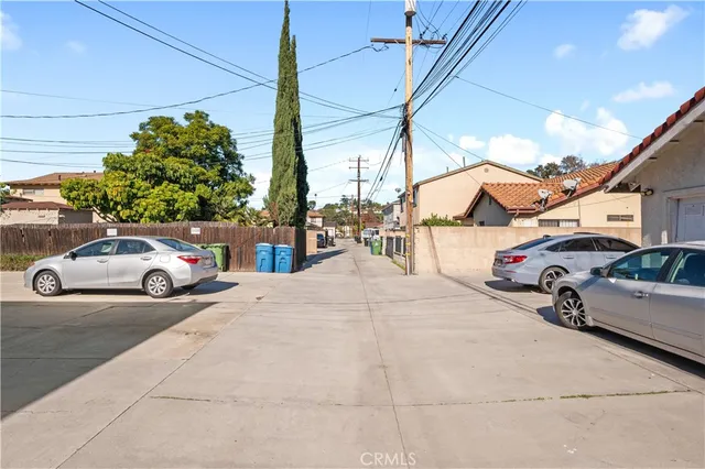 a view of a cars parked in front of a house