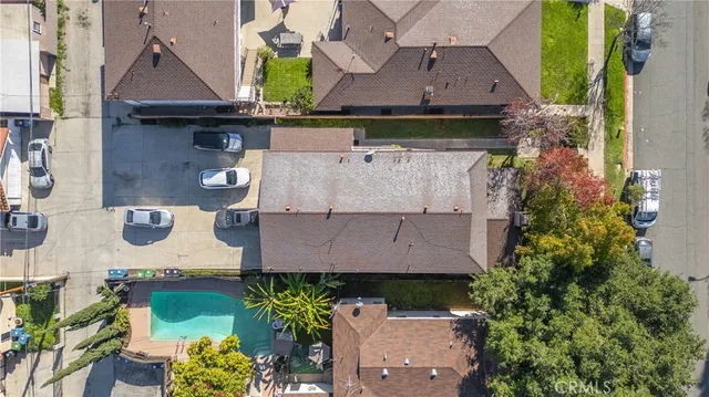 an aerial view of a house with a swimming pool