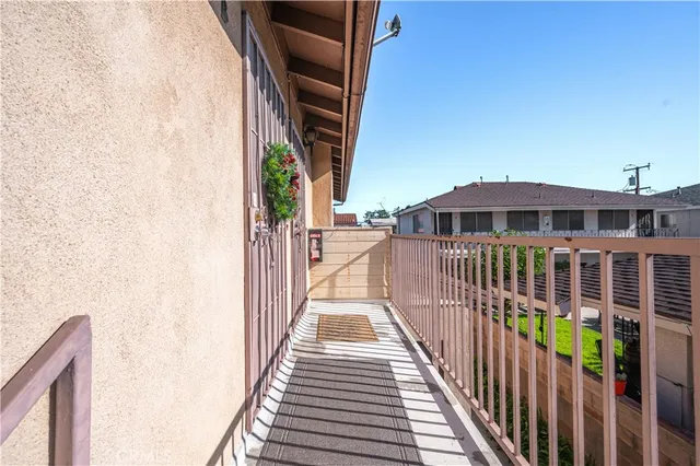 a view of a balcony with wooden floor