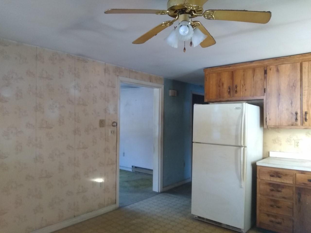220 East Jay Road Jay, ME 04239 - Photo 9 of 21 0328 refrig and archway into living room