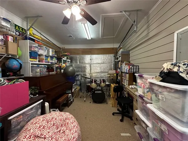 a room with gym equipment and a large window