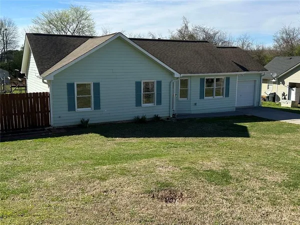 a house view with a garden space