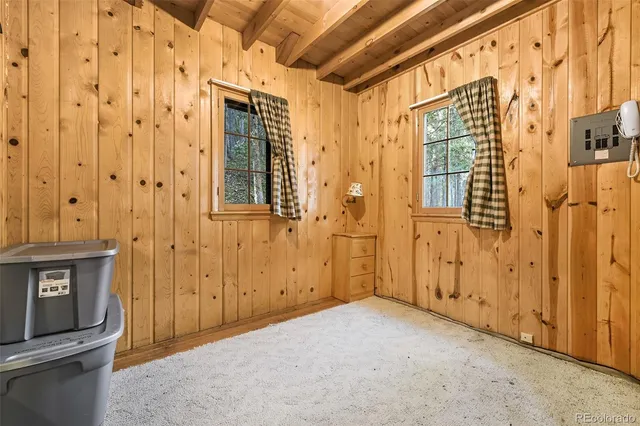 a view of a door with wooden walls