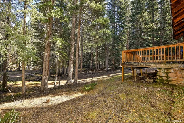 a view of a chair and tables in the patio