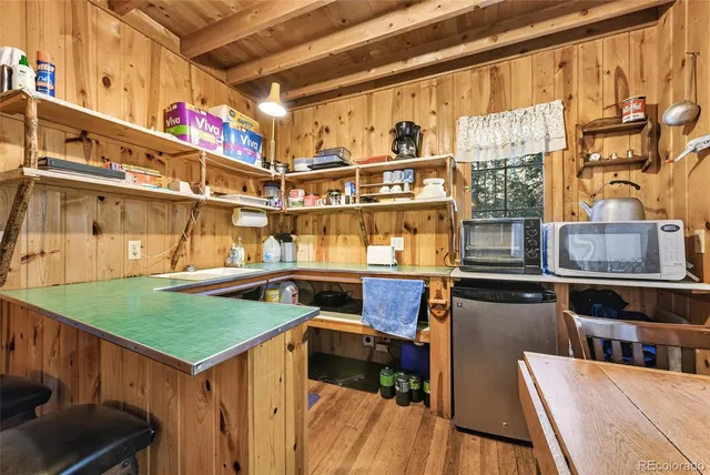 a utility room with multiple dryer and washer