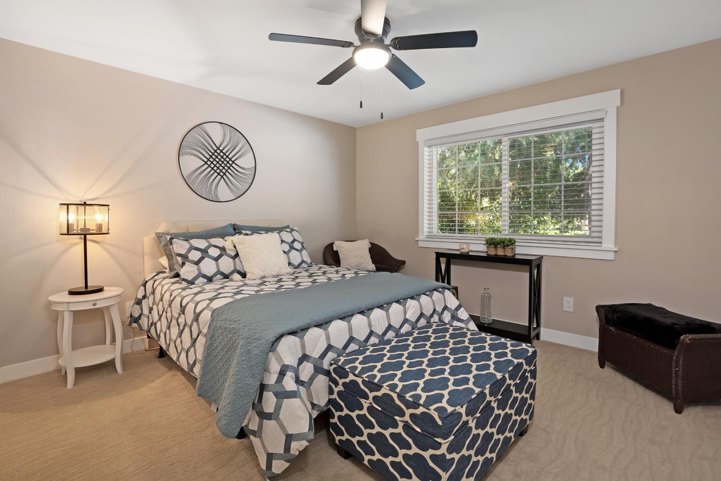 105 Rays Circle Hollister, CA 95023 - Photo 26 of 36 a bedroom with a large bed and a chandelier