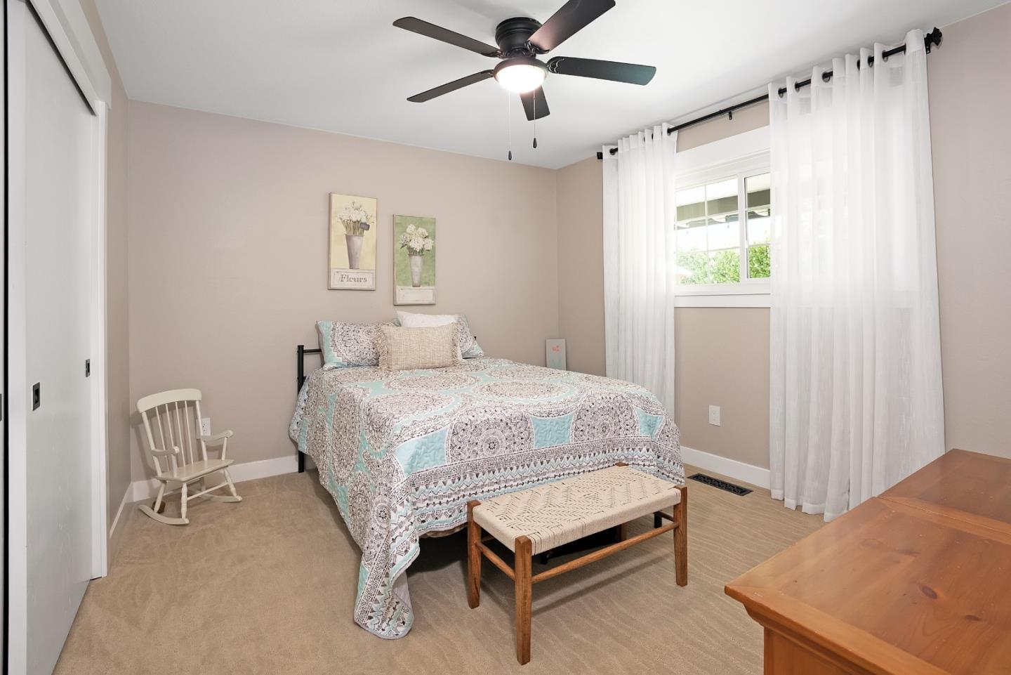 105 Rays Circle Hollister, CA 95023 - Photo 27 of 36 a bedroom with a bed and a table