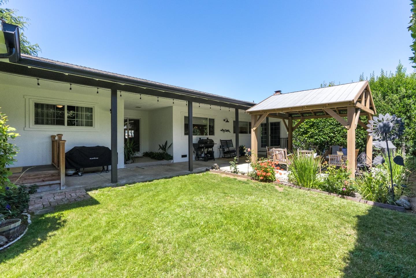 105 Rays Circle Hollister, CA 95023 - Photo 32 of 36 a view of a house with backyard porch and sitting area