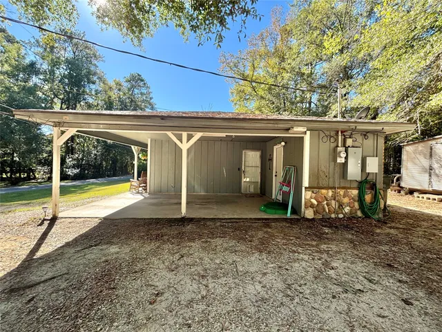 a view of a two chairs in the patio