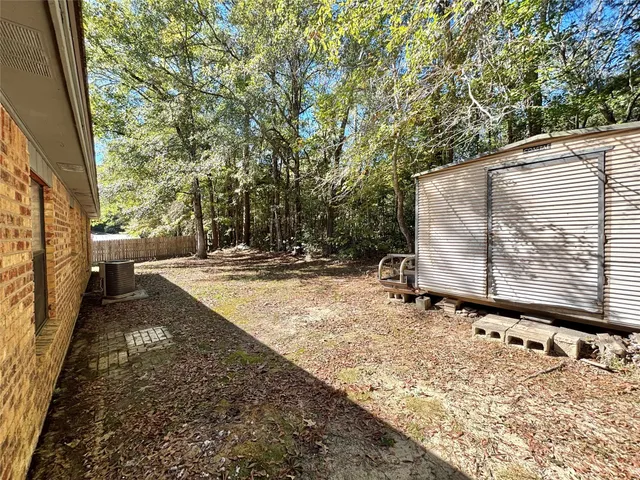 a view of a yard with an outdoor space