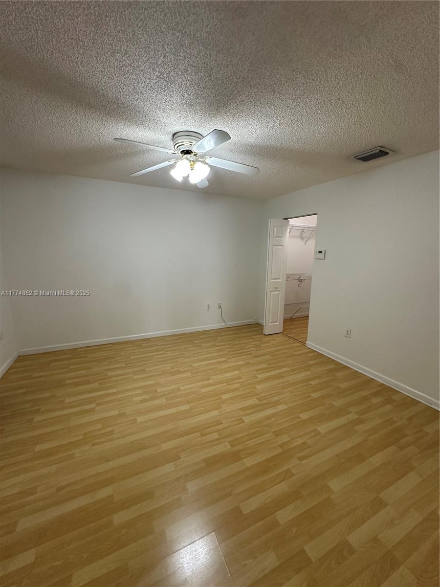 Westbrooke at Avalon Hialeah, FL 33015 - Photo 17 of 24 a view of empty room with wooden floor