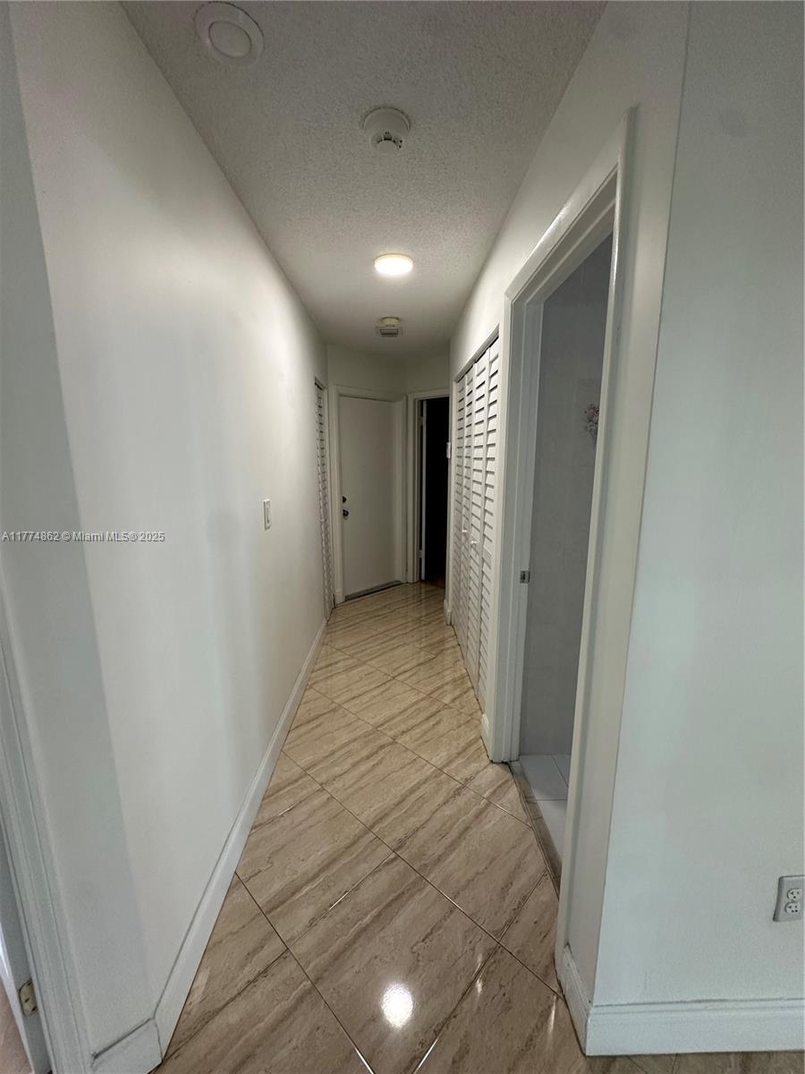 Westbrooke at Avalon Hialeah, FL 33015 - Photo 7 of 24 a view of hallway with wooden floor