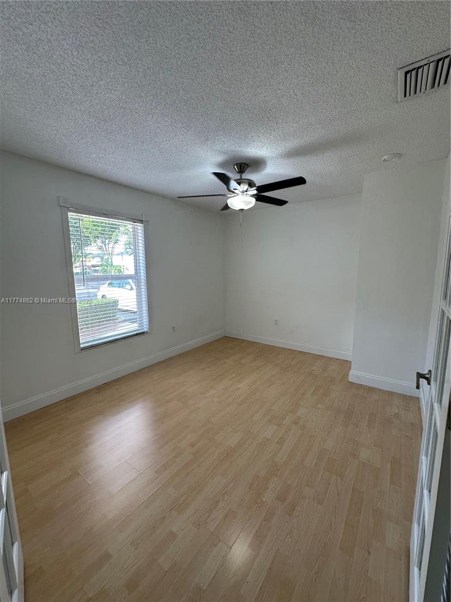 Westbrooke at Avalon Hialeah, FL 33015 - Photo 9 of 24 an empty room with a window and a ceiling fan