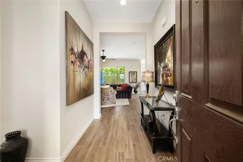 a view of a livingroom with furniture and hardwood floor