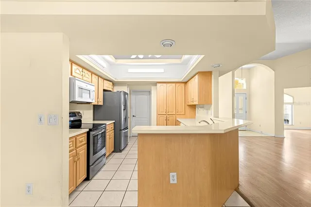 a kitchen with stainless steel appliances granite countertop a sink and stove