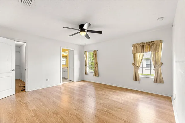 a view of a room with wooden floor