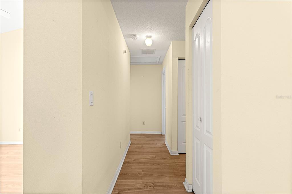 10884 Southwest 53rd Circle Ocala, FL 34476 - Photo 31 of 57 a view of a hallway with wooden floor