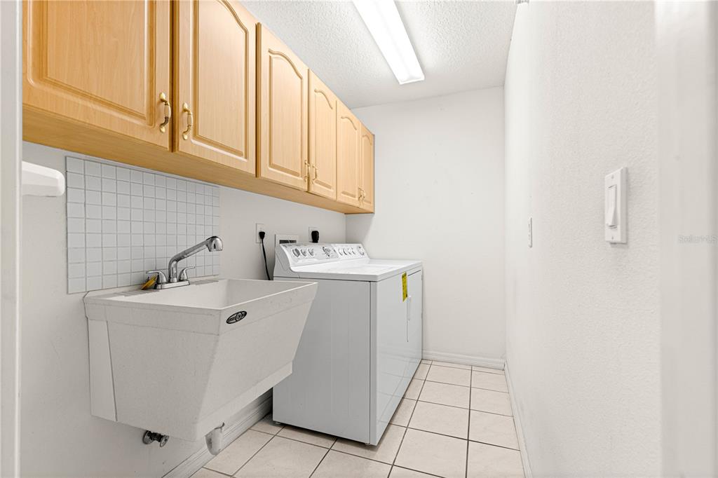 10884 Southwest 53rd Circle Ocala, FL 34476 - Photo 38 of 57 a utility room with dryer and washer