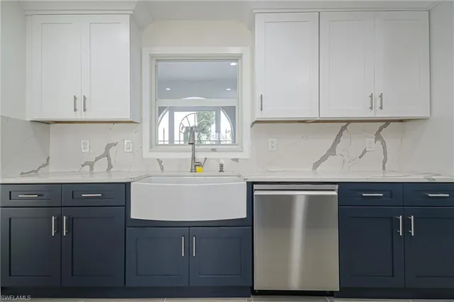 a kitchen with cabinets and white appliances