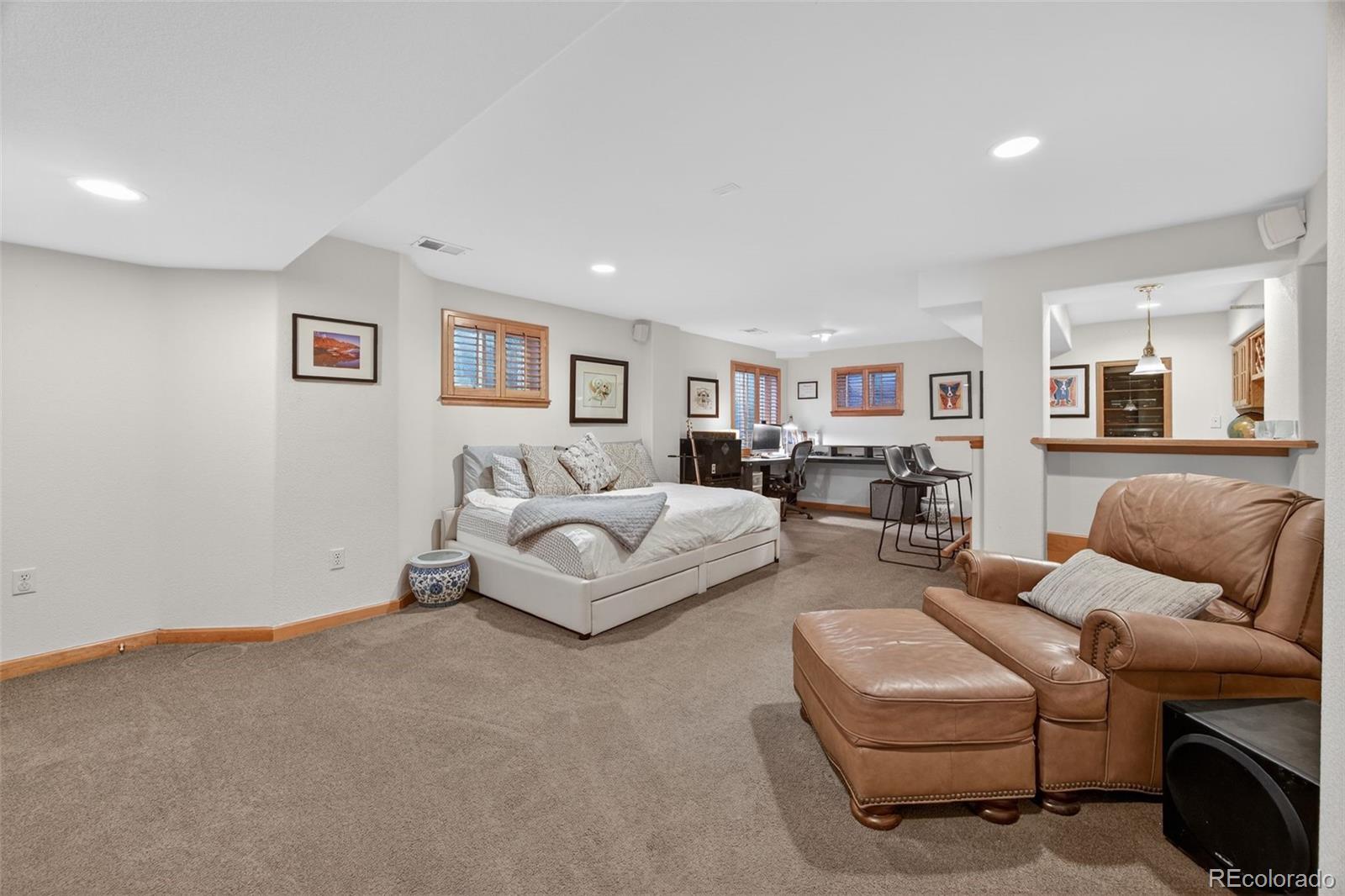 8764 Wildrose Court Highlands Ranch, CO 80126 - Photo 14 of 50 a living room with furniture and a couch