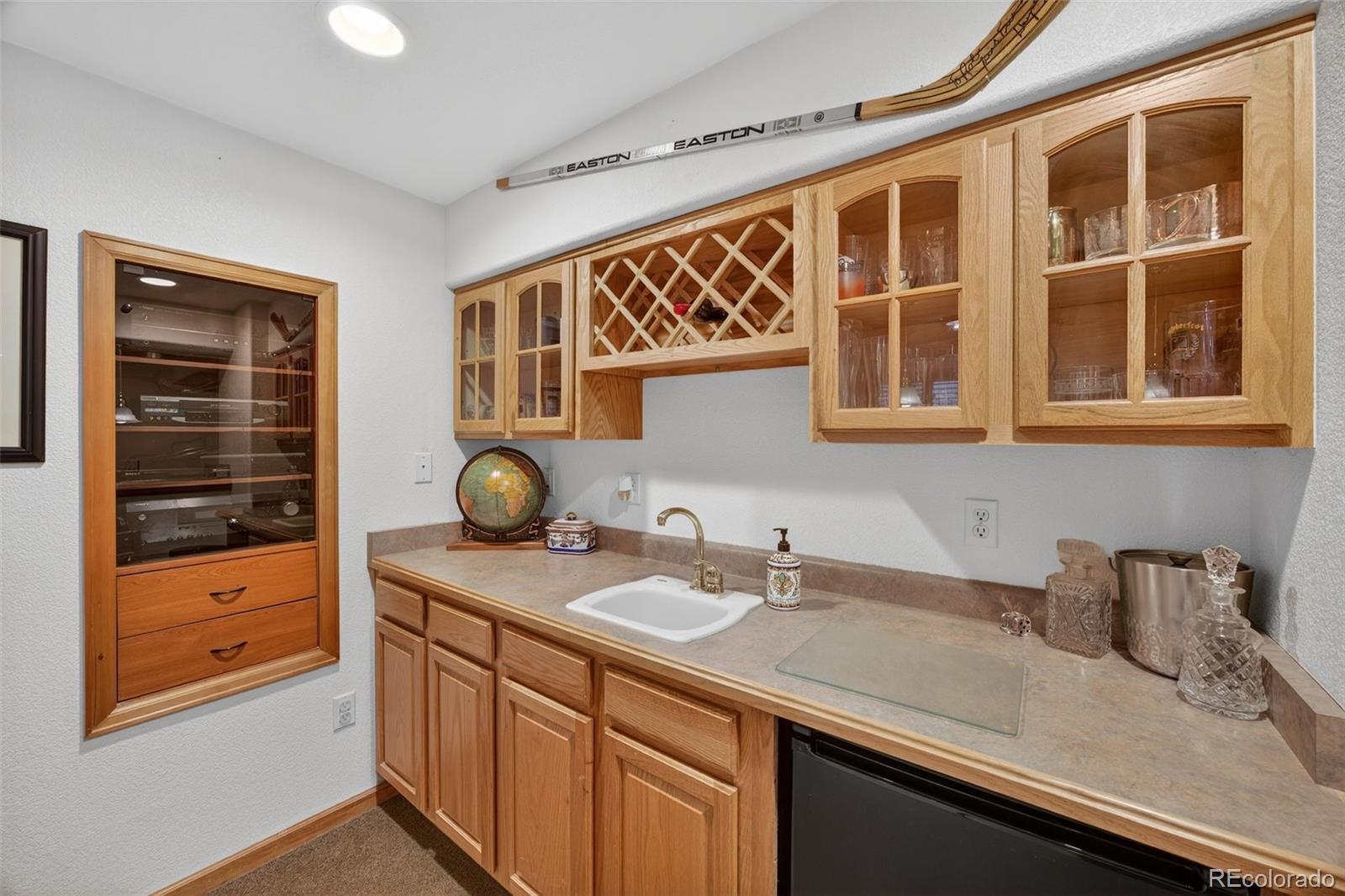 8764 Wildrose Court Highlands Ranch, CO 80126 - Photo 16 of 50 a bathroom with a sink and a mirror