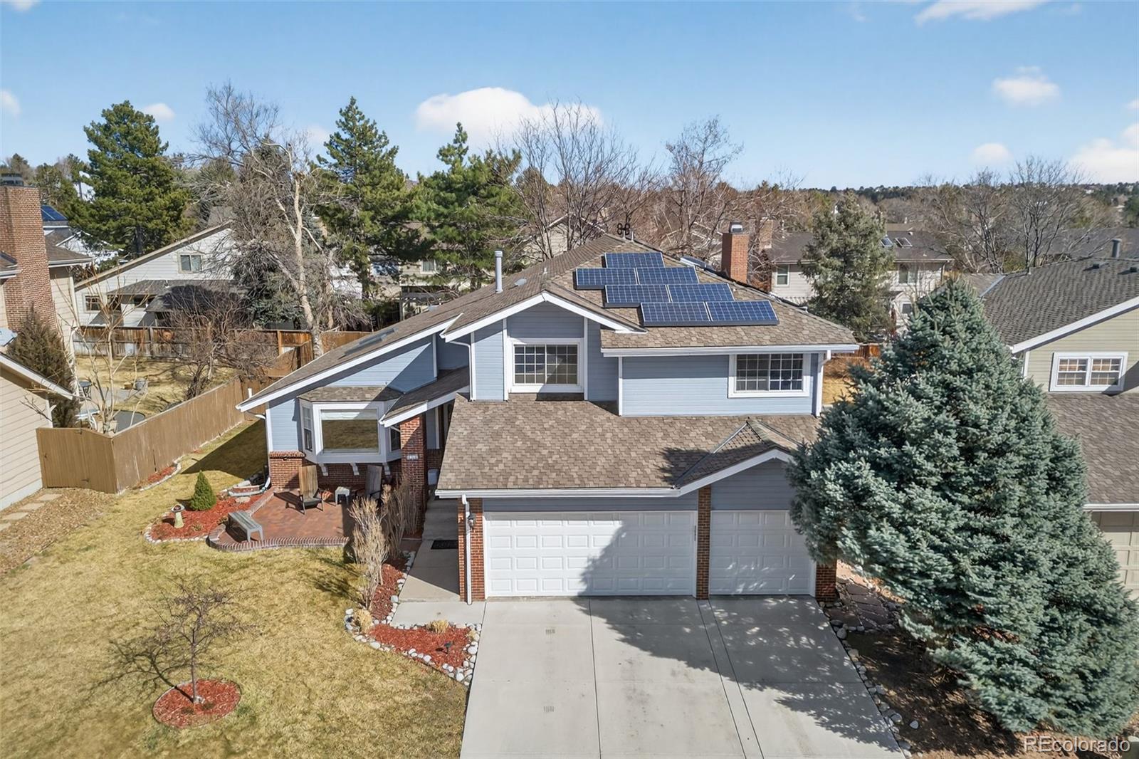 8764 Wildrose Court Highlands Ranch, CO 80126 - Photo 2 of 50 a aerial view of a house with a yard