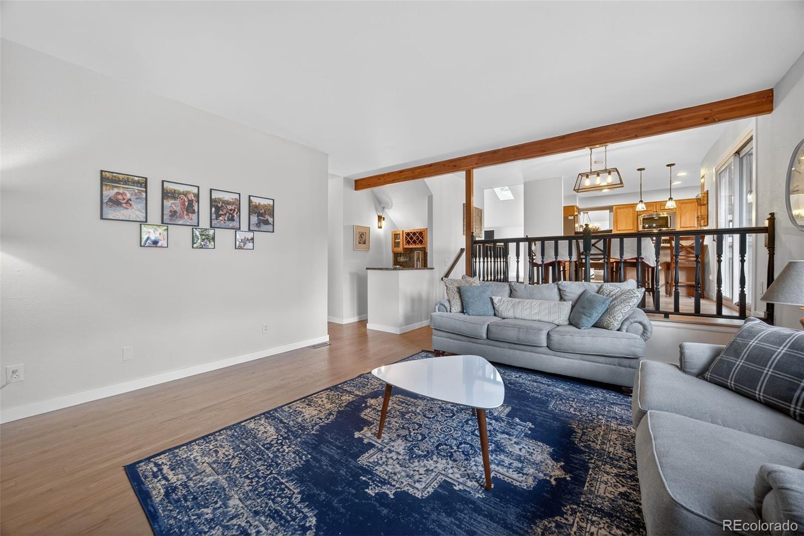 8764 Wildrose Court Highlands Ranch, CO 80126 - Photo 28 of 50 a living room with furniture and a rug