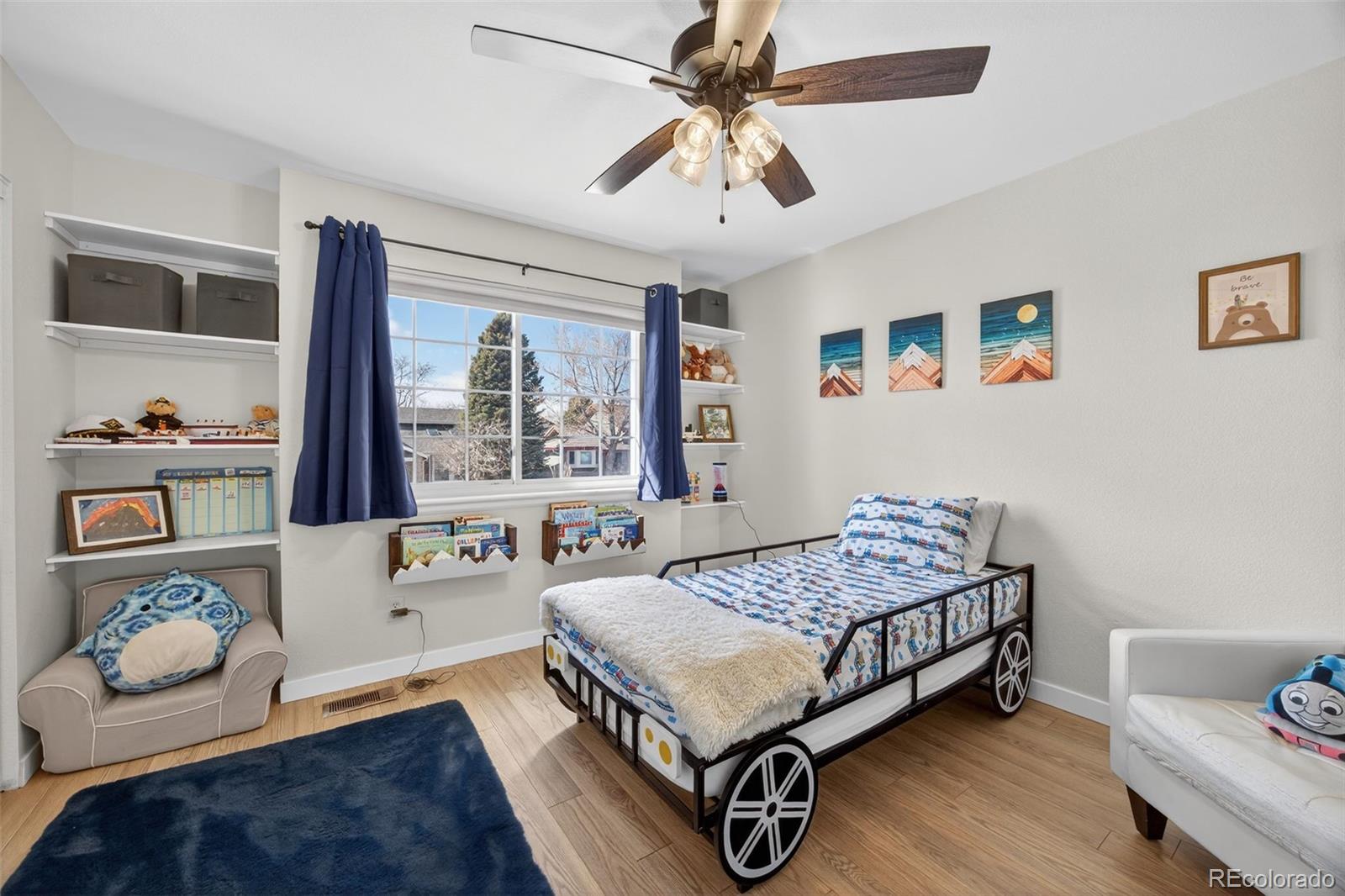 8764 Wildrose Court Highlands Ranch, CO 80126 - Photo 39 of 50 a bedroom with a bed and a window