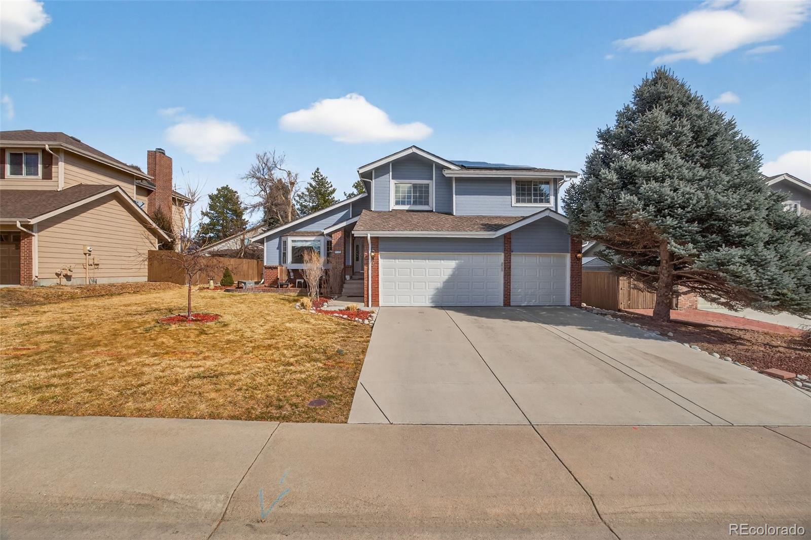 8764 Wildrose Court Highlands Ranch, CO 80126 - Photo 47 of 50 a front view of a house with garage