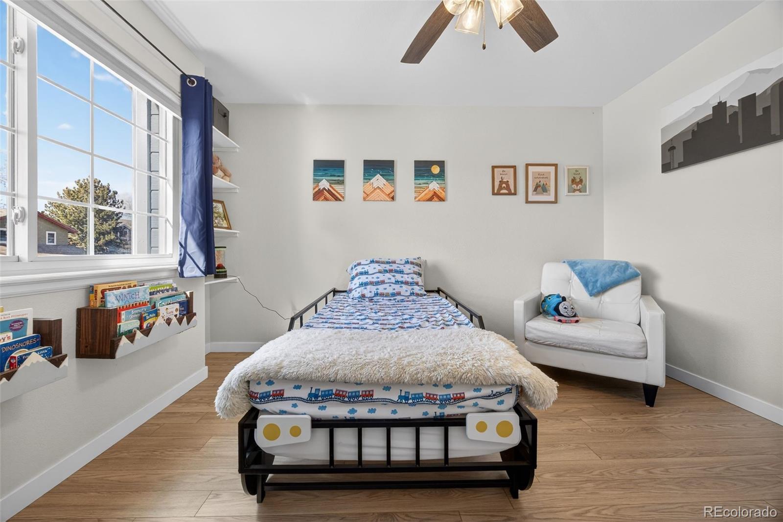 8764 Wildrose Court Highlands Ranch, CO 80126 - Photo 6 of 50 a living room with furniture and a couch