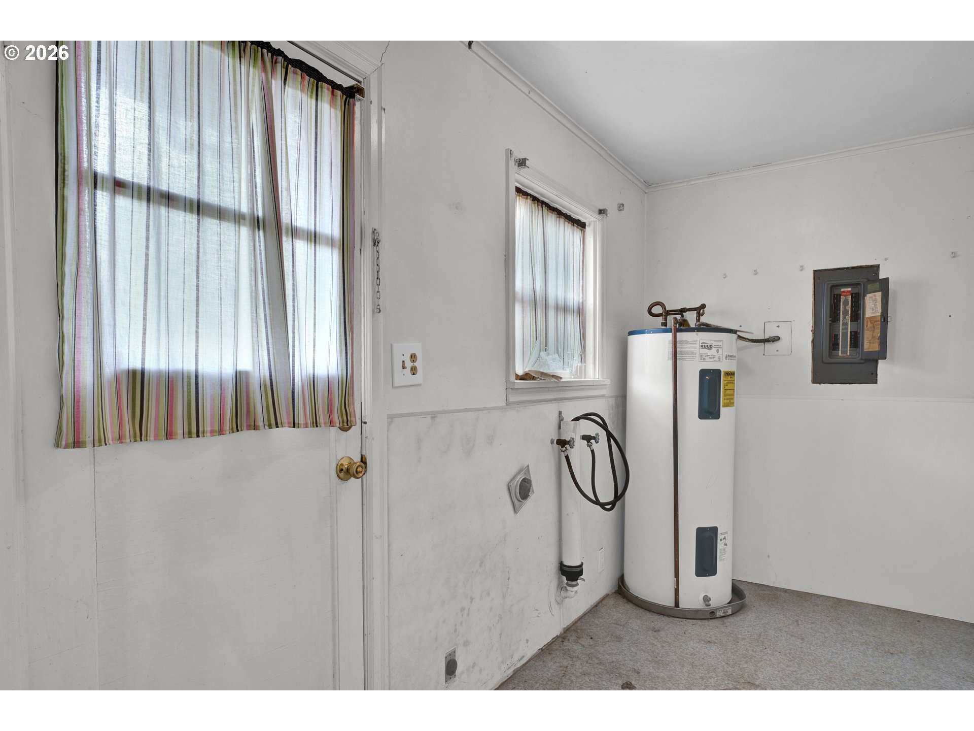 930 1st Street Springfield, OR 97477 - Photo 12 of 43 a bathroom with a granite countertop sink a mirror and shower