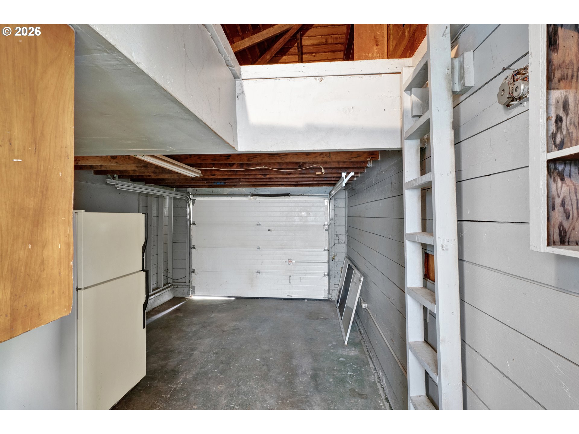 930 1st Street Springfield, OR 97477 - Photo 15 of 43 a view of storage and utility room with a refrigerator