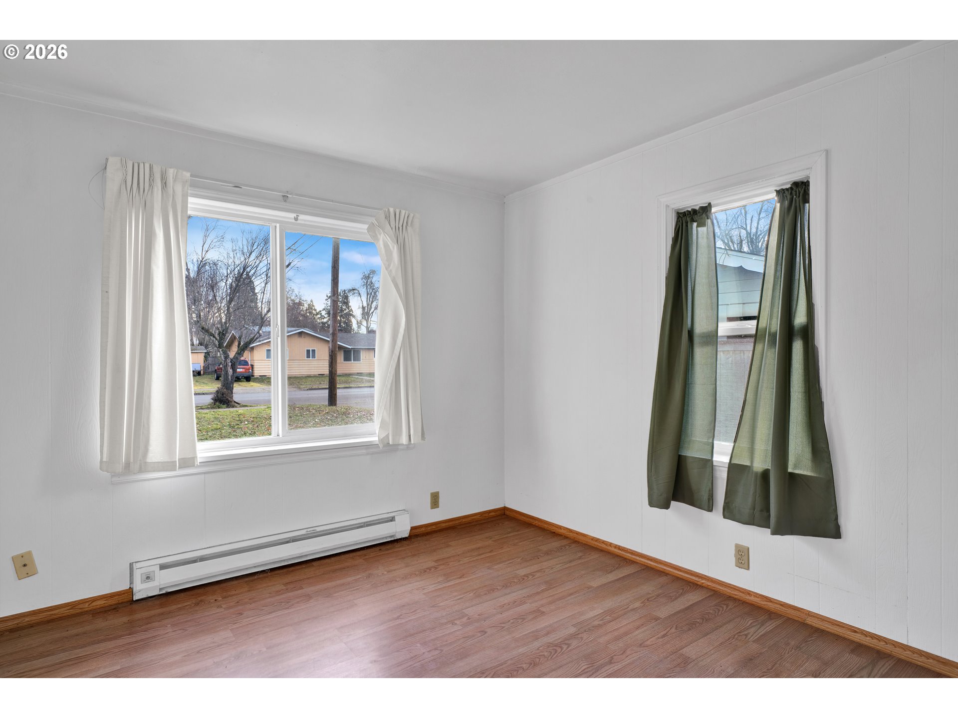 930 1st Street Springfield, OR 97477 - Photo 20 of 43 an empty room with wooden floor and a window