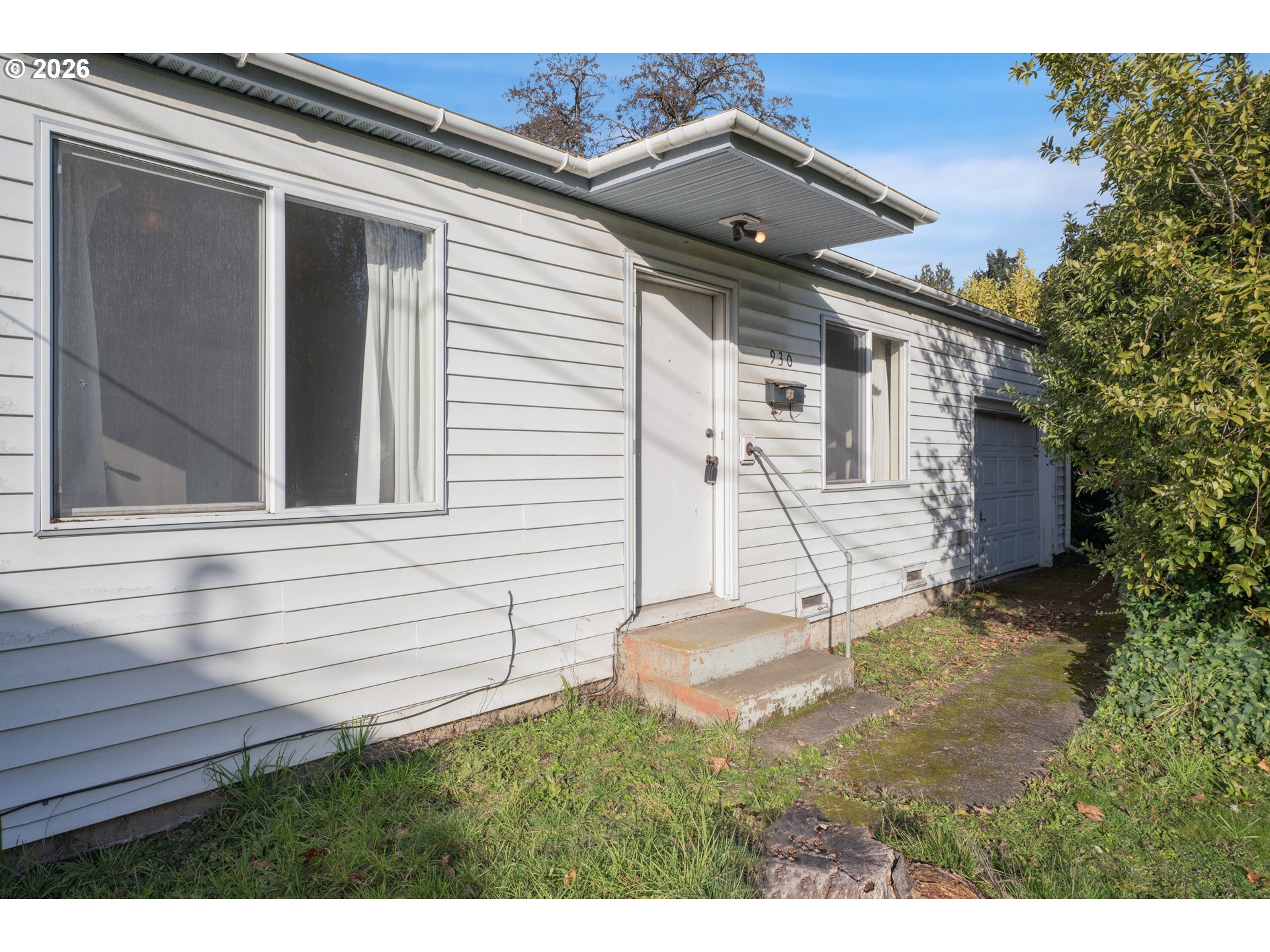 930 1st Street Springfield, OR 97477 - Photo 2 of 43 a backyard of a house with table and chairs