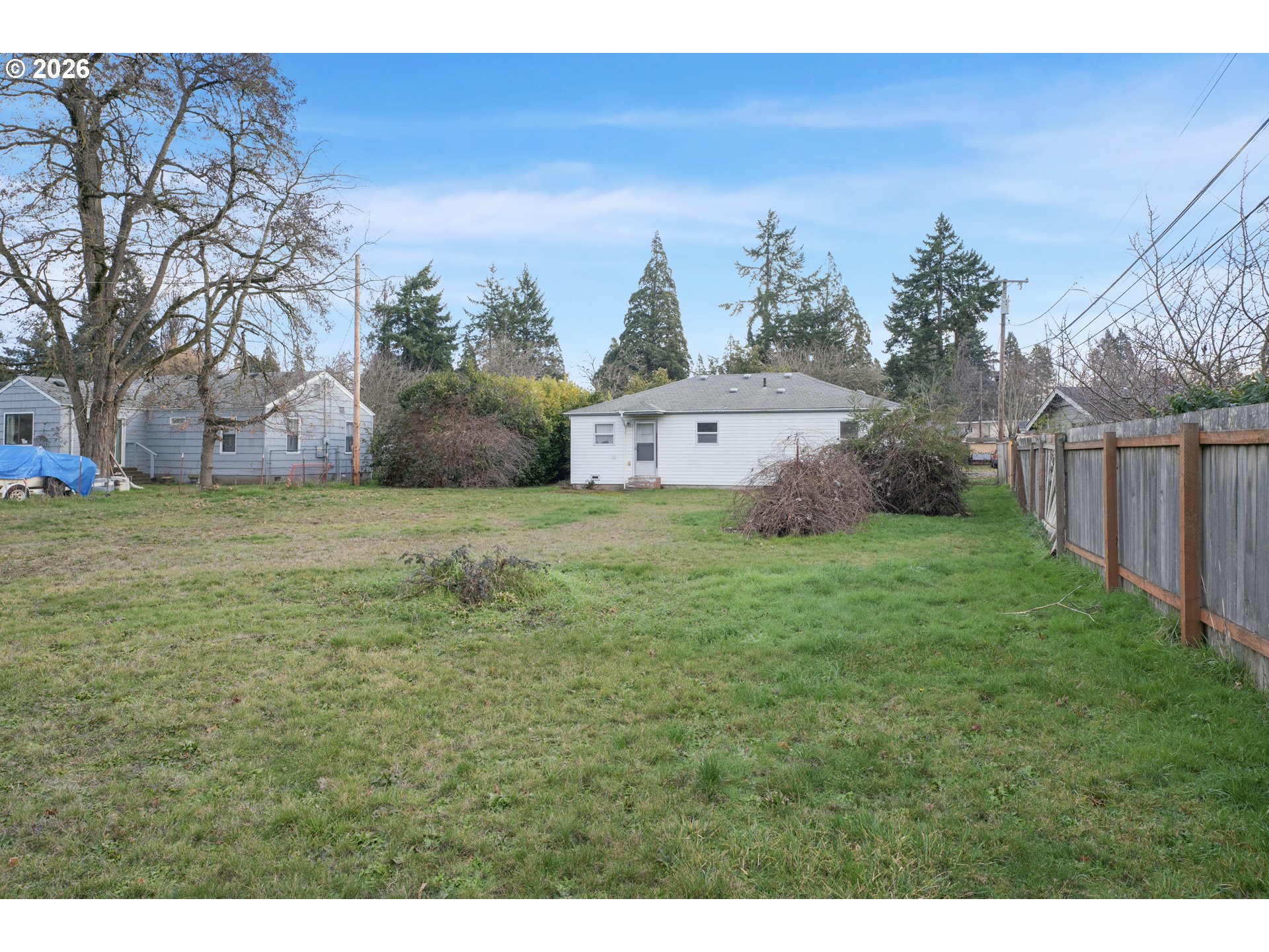 930 1st Street Springfield, OR 97477 - Photo 28 of 43 a view of a big yard with plants and a bench