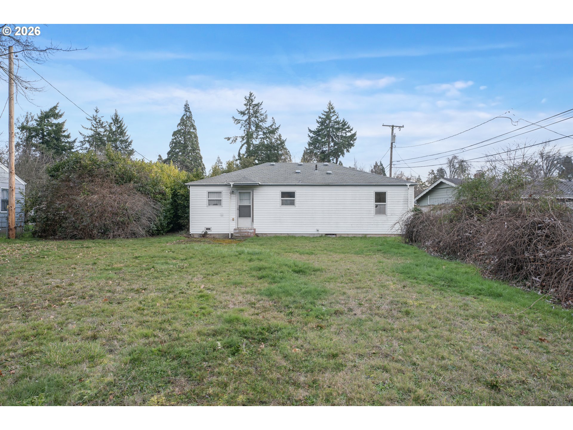 930 1st Street Springfield, OR 97477 - Photo 29 of 43 a view of a house with a yard