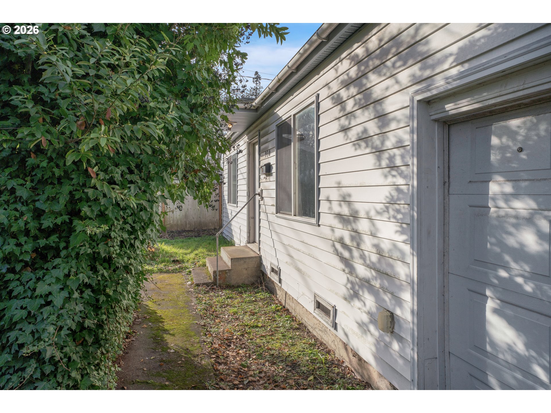 930 1st Street Springfield, OR 97477 - Photo 3 of 43 a view of a backyard with table and chairs and potted plants