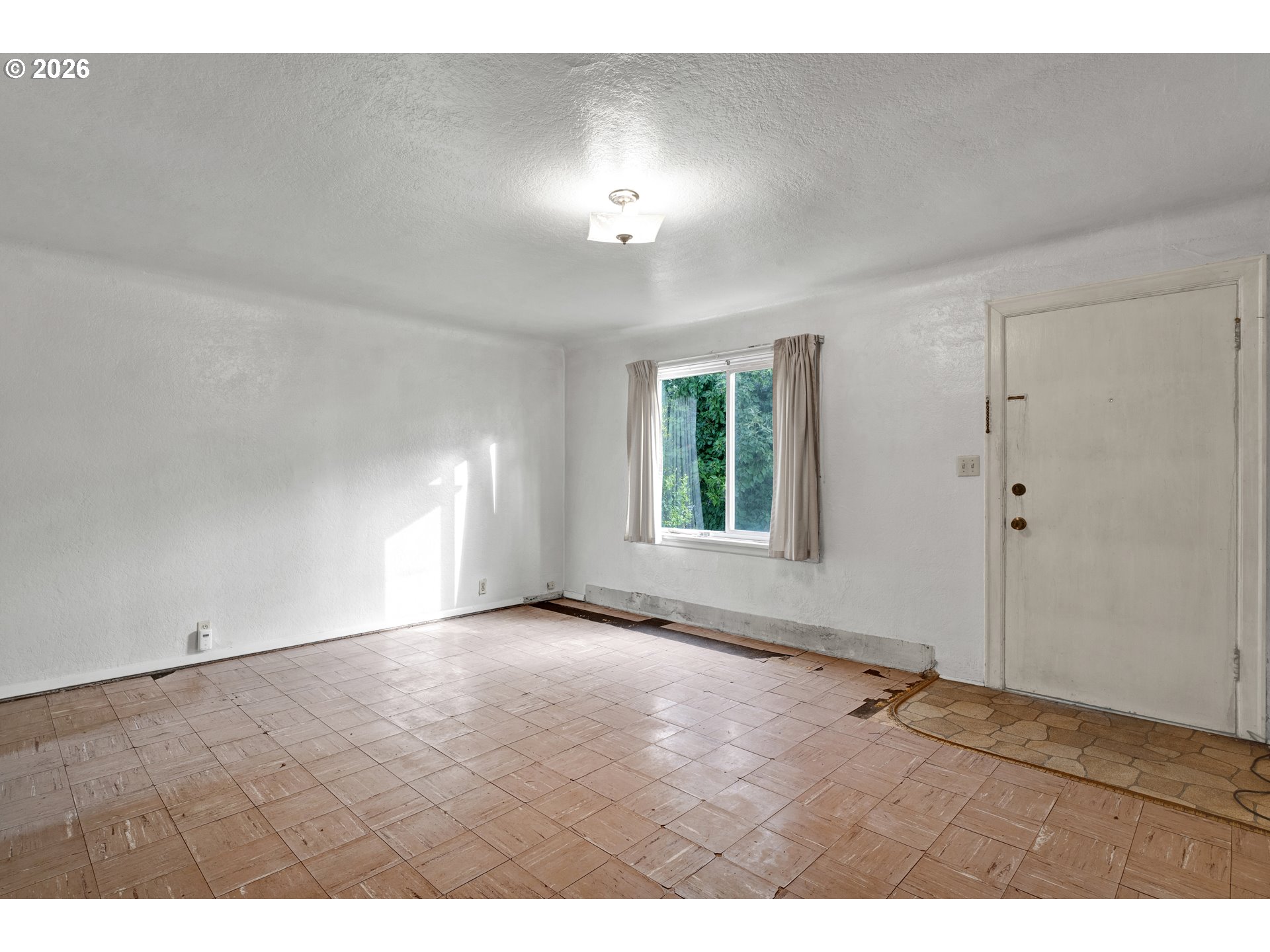 930 1st Street Springfield, OR 97477 - Photo 6 of 43 a view of an empty room with a window