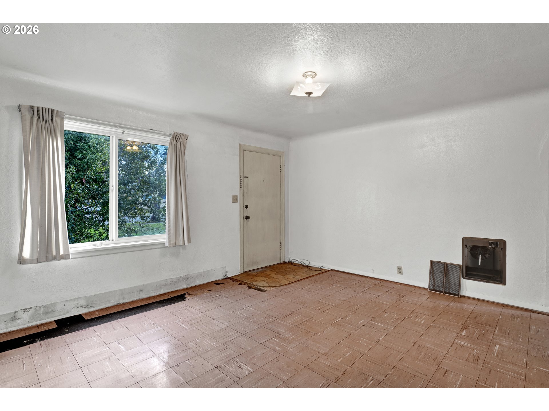 930 1st Street Springfield, OR 97477 - Photo 7 of 43 a view of an empty room with a window