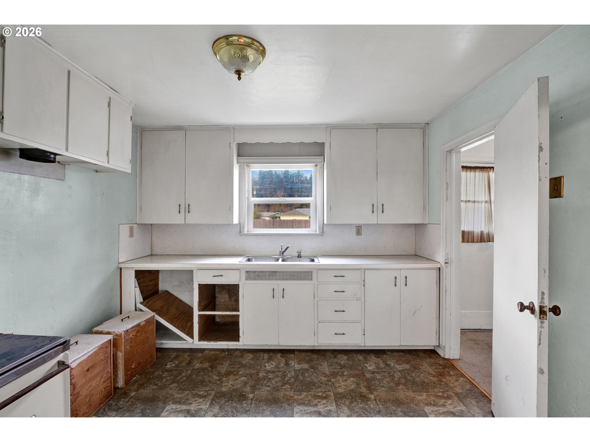 930 1st Street Springfield, OR 97477 - Photo 9 of 43 a kitchen with cabinets a sink and appliances