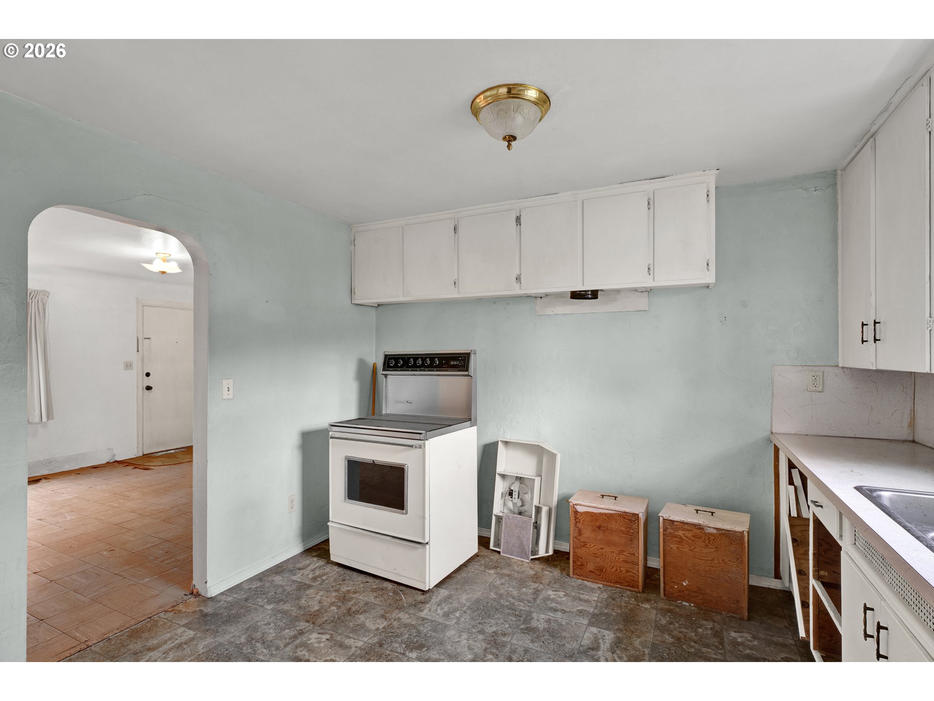 930 1st Street Springfield, OR 97477 - Photo 10 of 43 a kitchen with stainless steel appliances granite countertop a stove a sink and a microwave