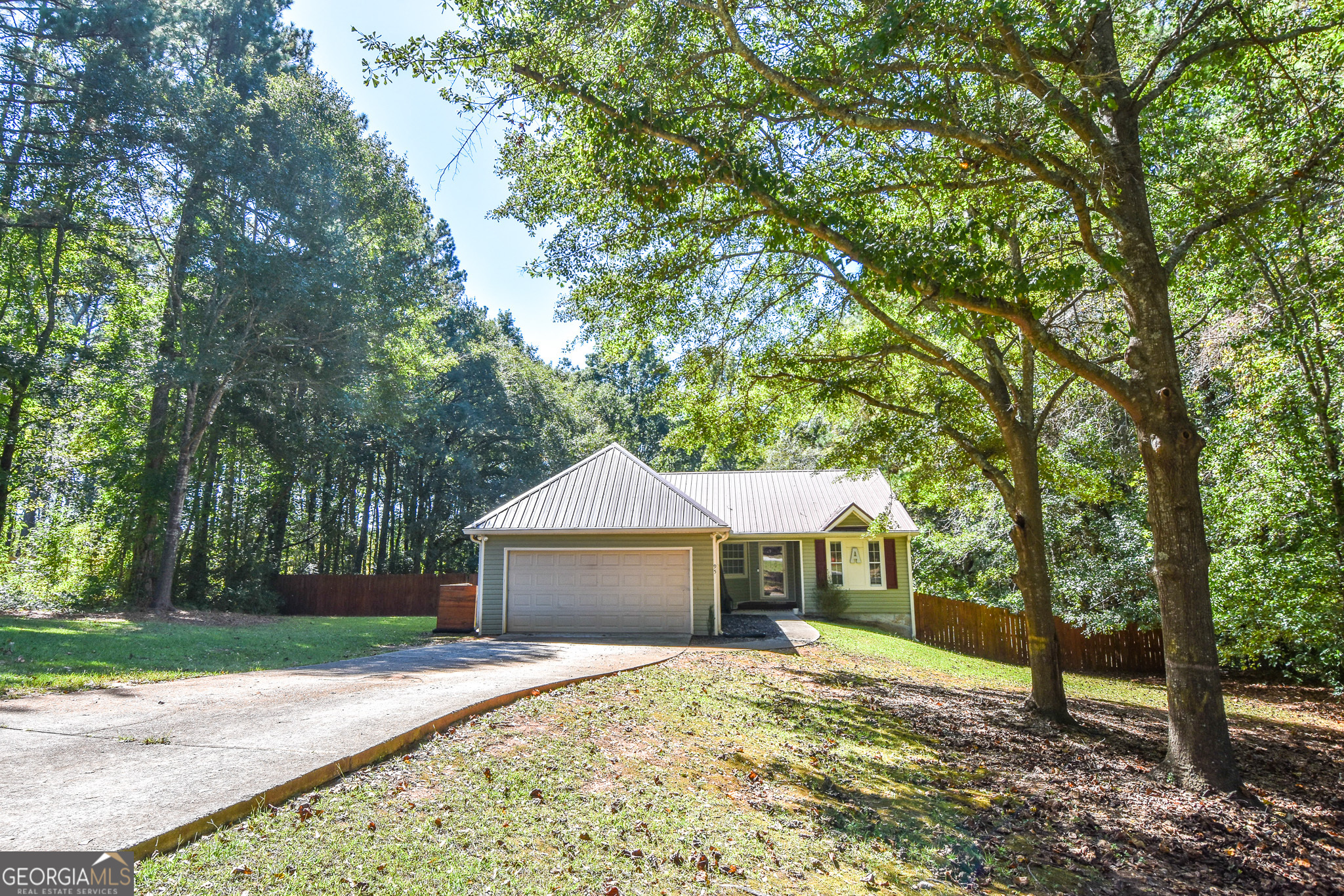 95 Joshua Court Zebulon, GA 30295 - Photo 1 of 1 a front view of a house with a yard and large trees