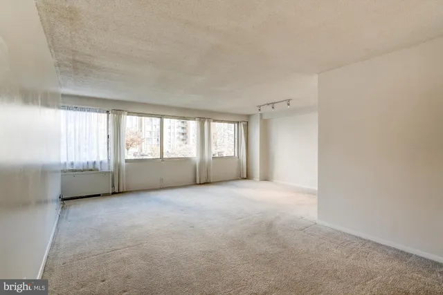 an empty room with windows