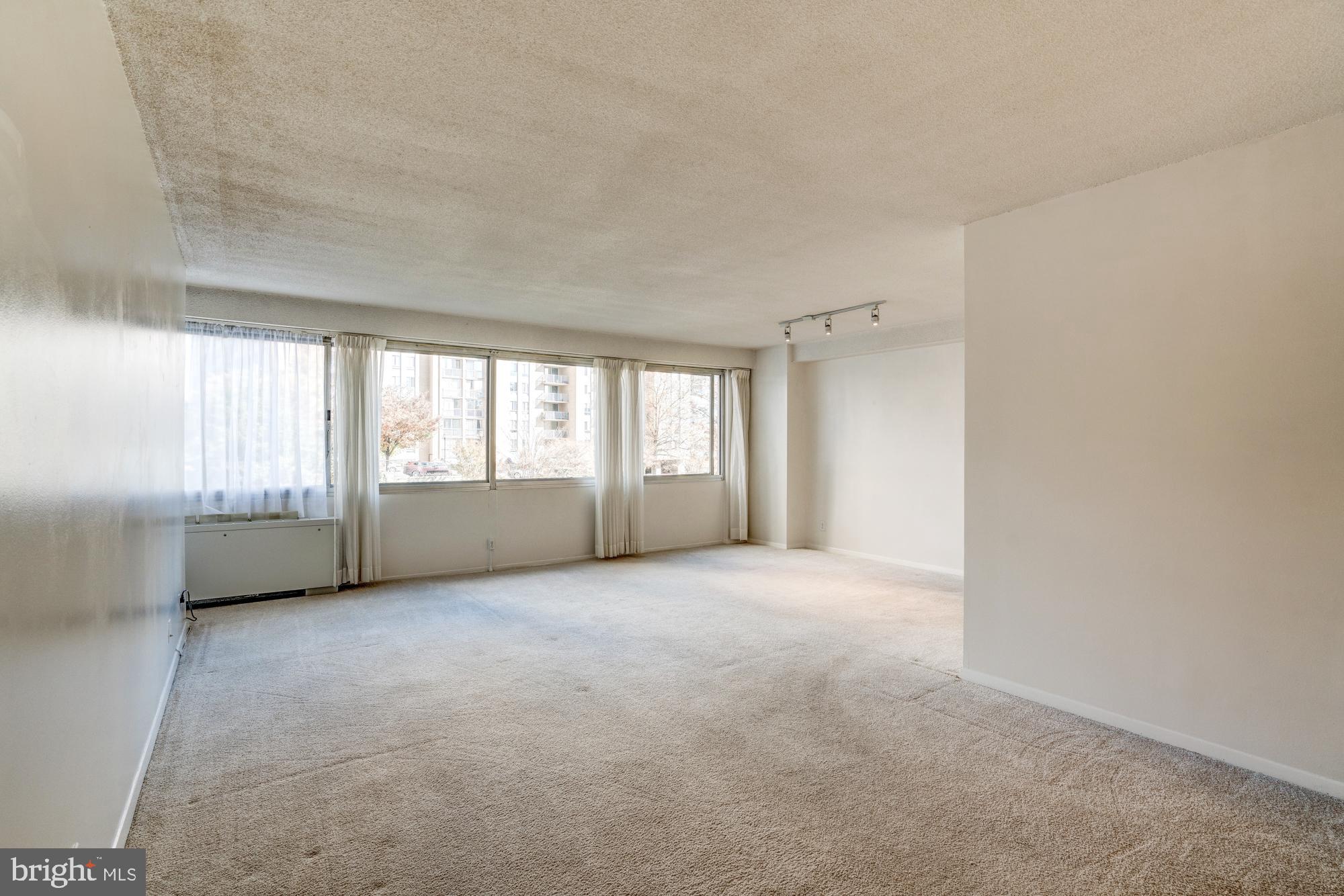 4515 Willard Avenue, Unit 719S Chevy Chase, MD 20815 - Photo 13 of 44 a view of an empty room with a window