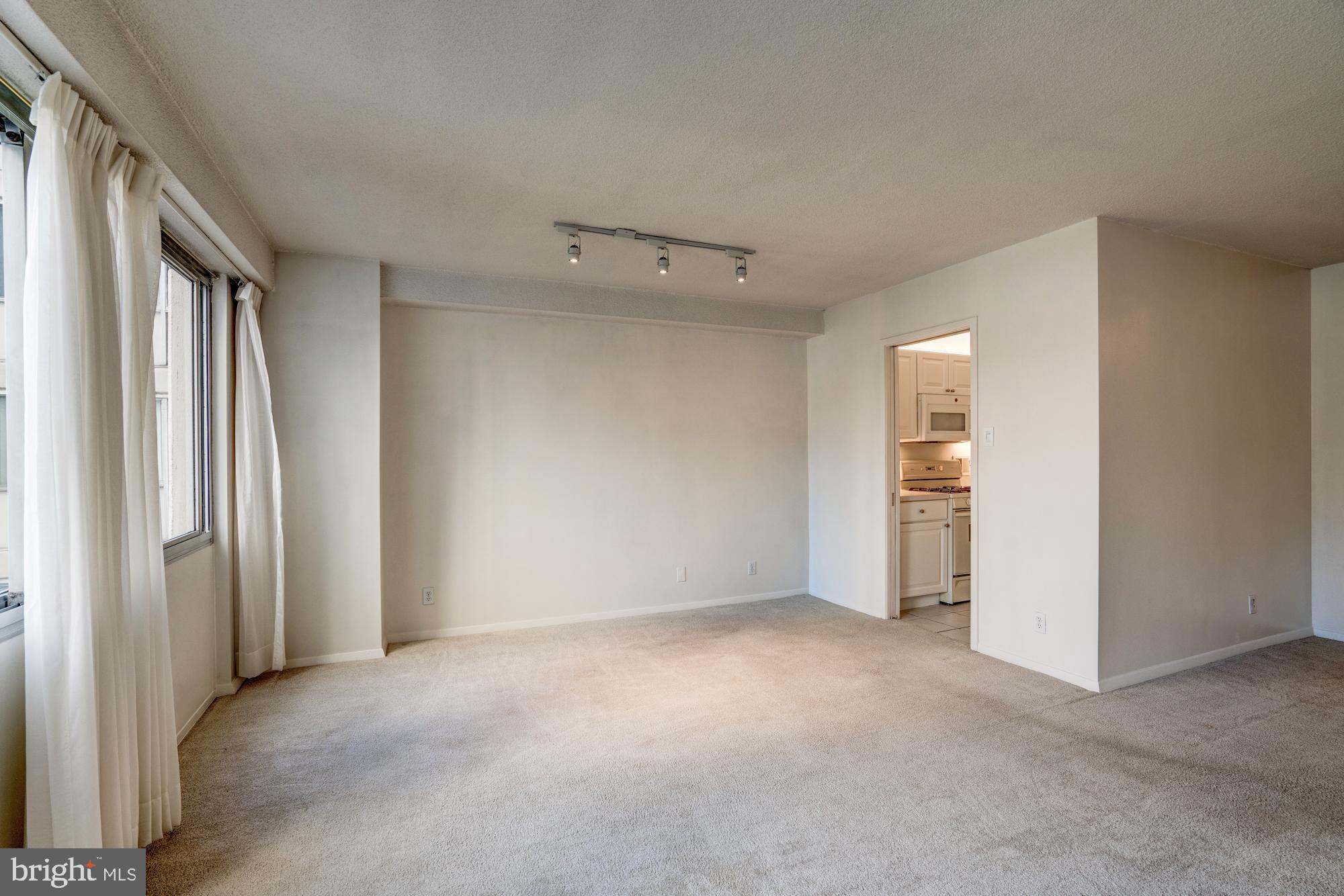 4515 Willard Avenue, Unit 719S Chevy Chase, MD 20815 - Photo 21 of 44 a view of an empty room and a window
